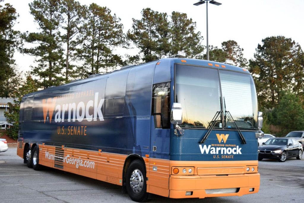 This image has an empty alt attribute; its file name is WarnockBus-1024x683.jpg